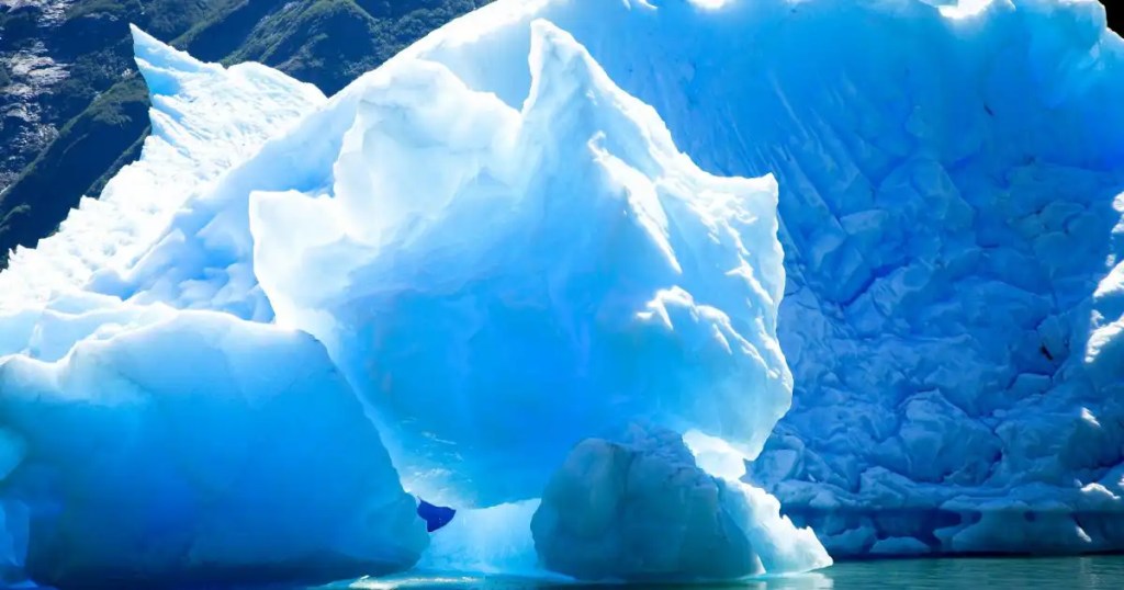 Glacier Ice exhibits a similar intense turquoise color due to blue light rays scattering while red is absorbed.